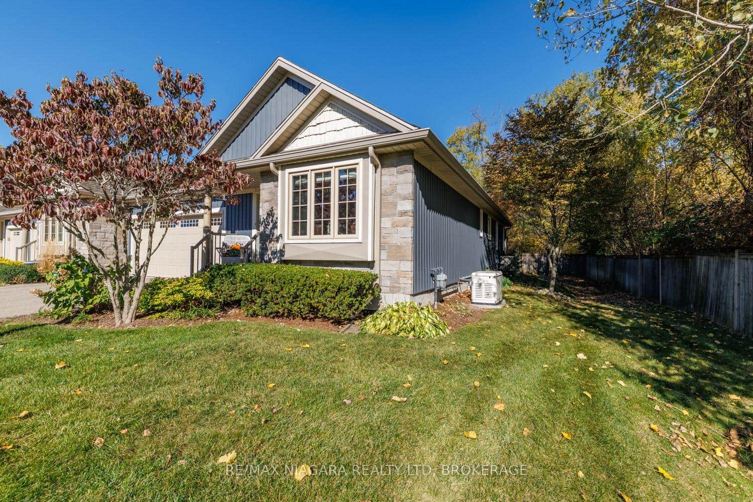 Private, large end-unit with double-wide driveway