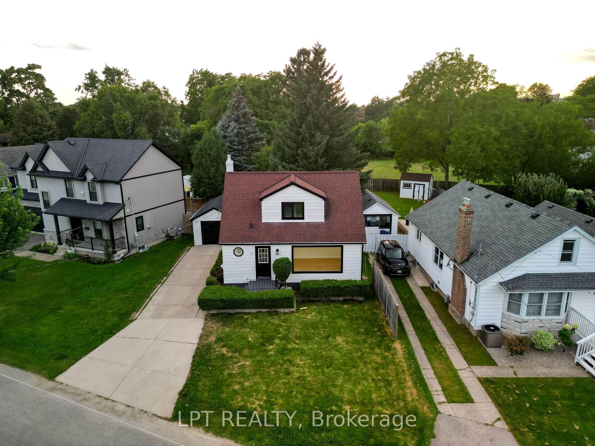 home, private driveway, attached garage.