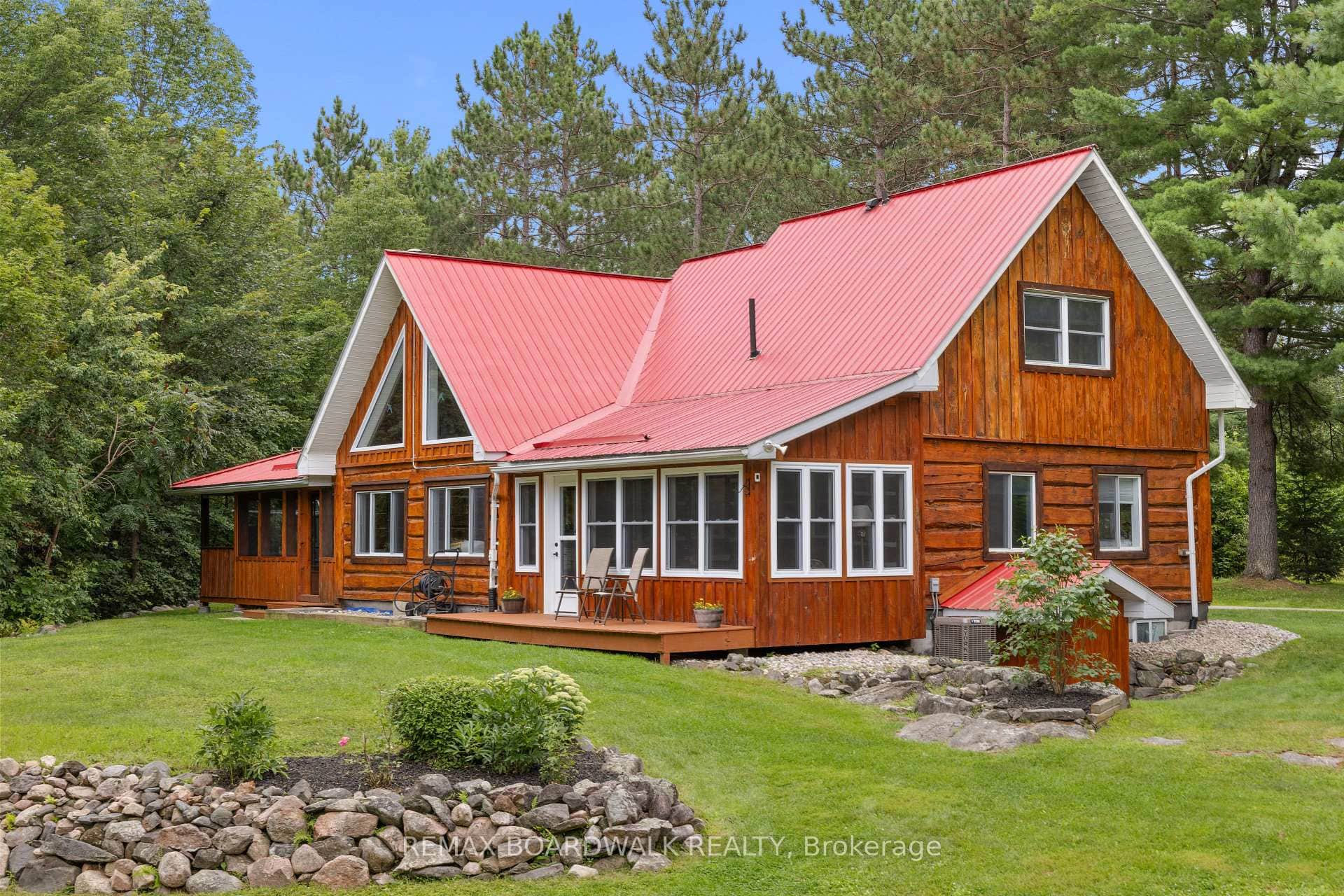 Striking log home in a lush country setting.