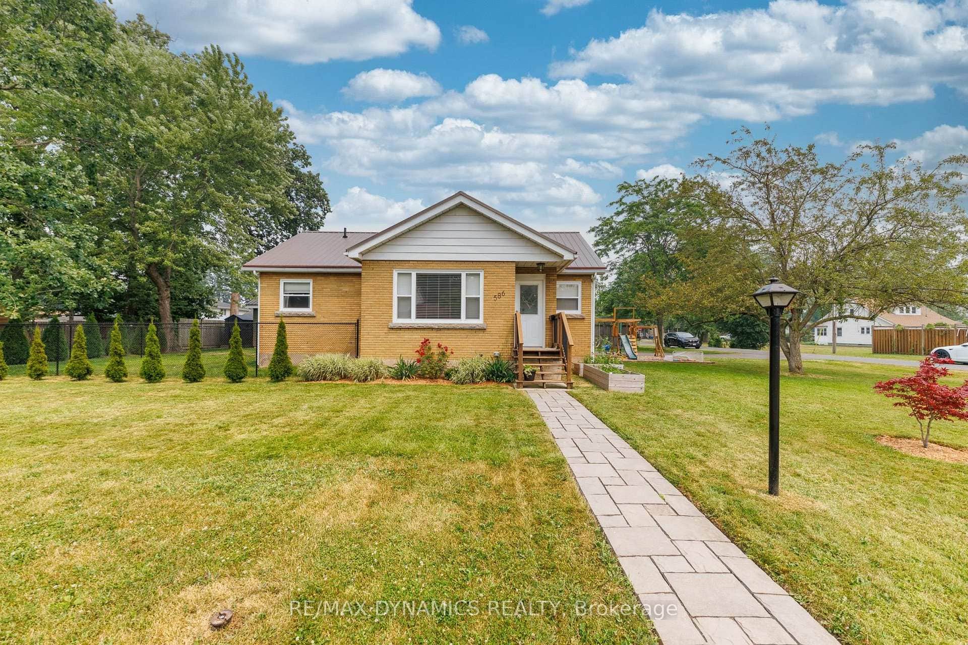 solid brick home with a metal roof
