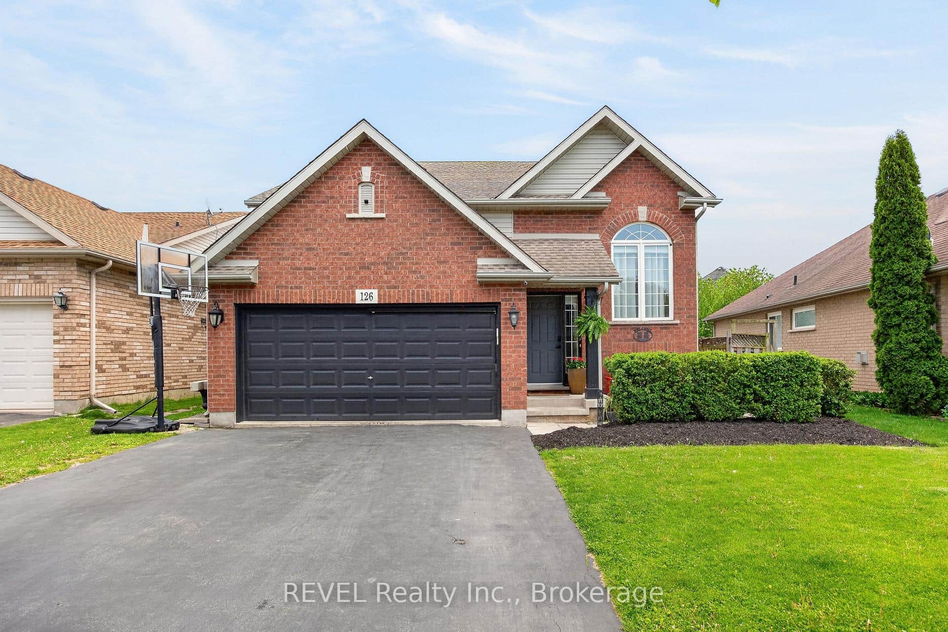 Raised Bungalow with double car garage.