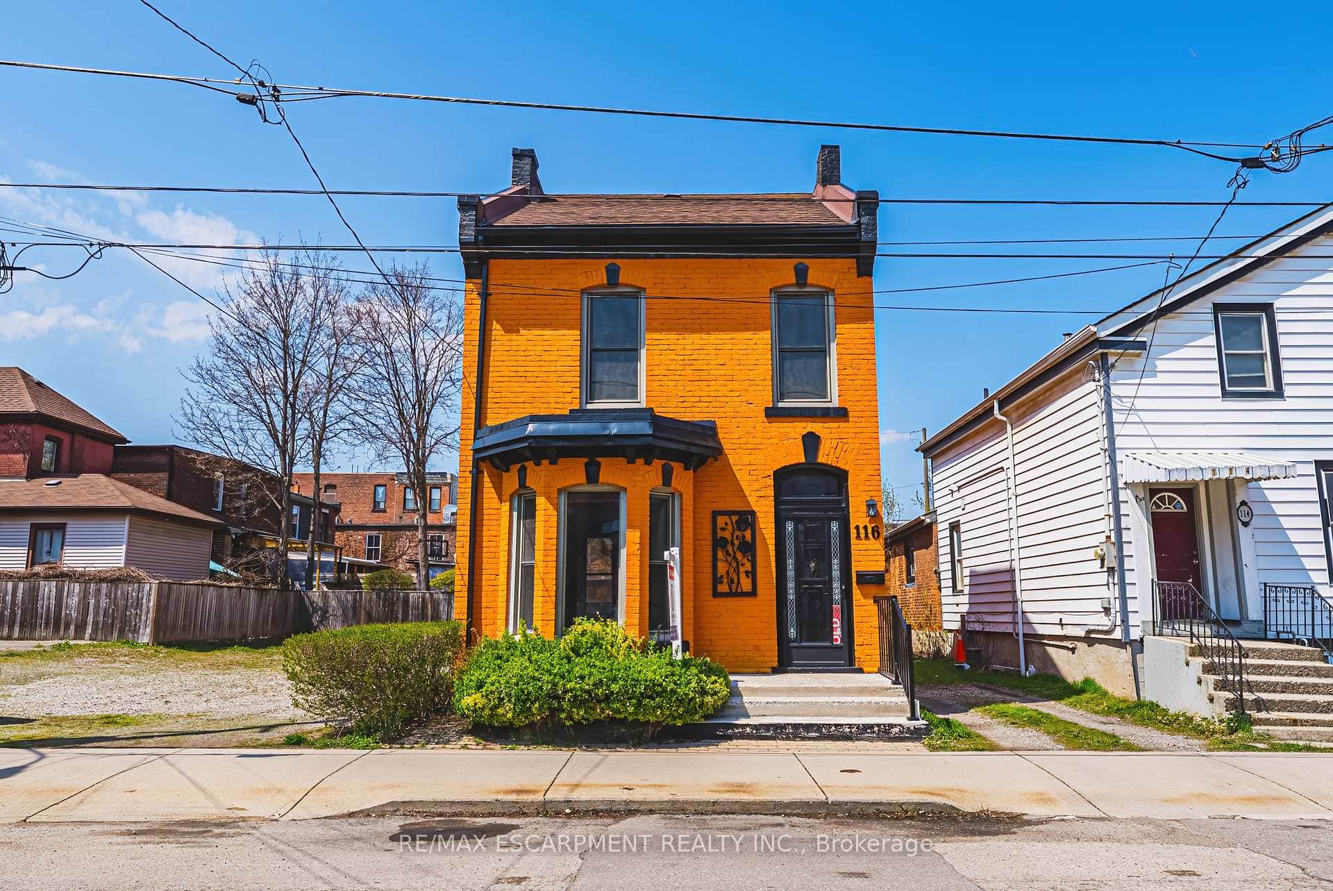 Vibrant orange brick facade w/black trim detailing