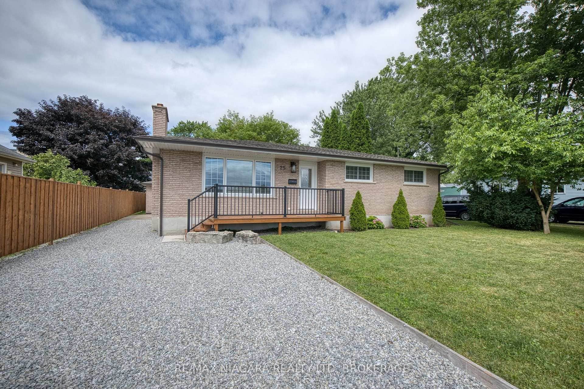 Front of house, driveway leading to 2-car garage