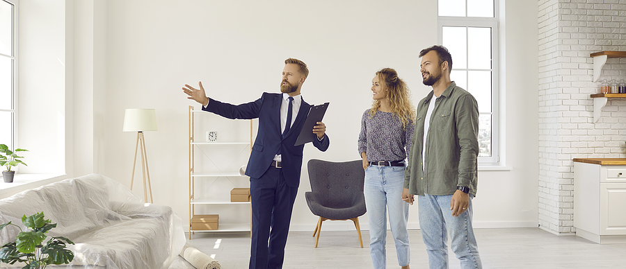 bigstock Real Estate Agent Giving Young 434980694